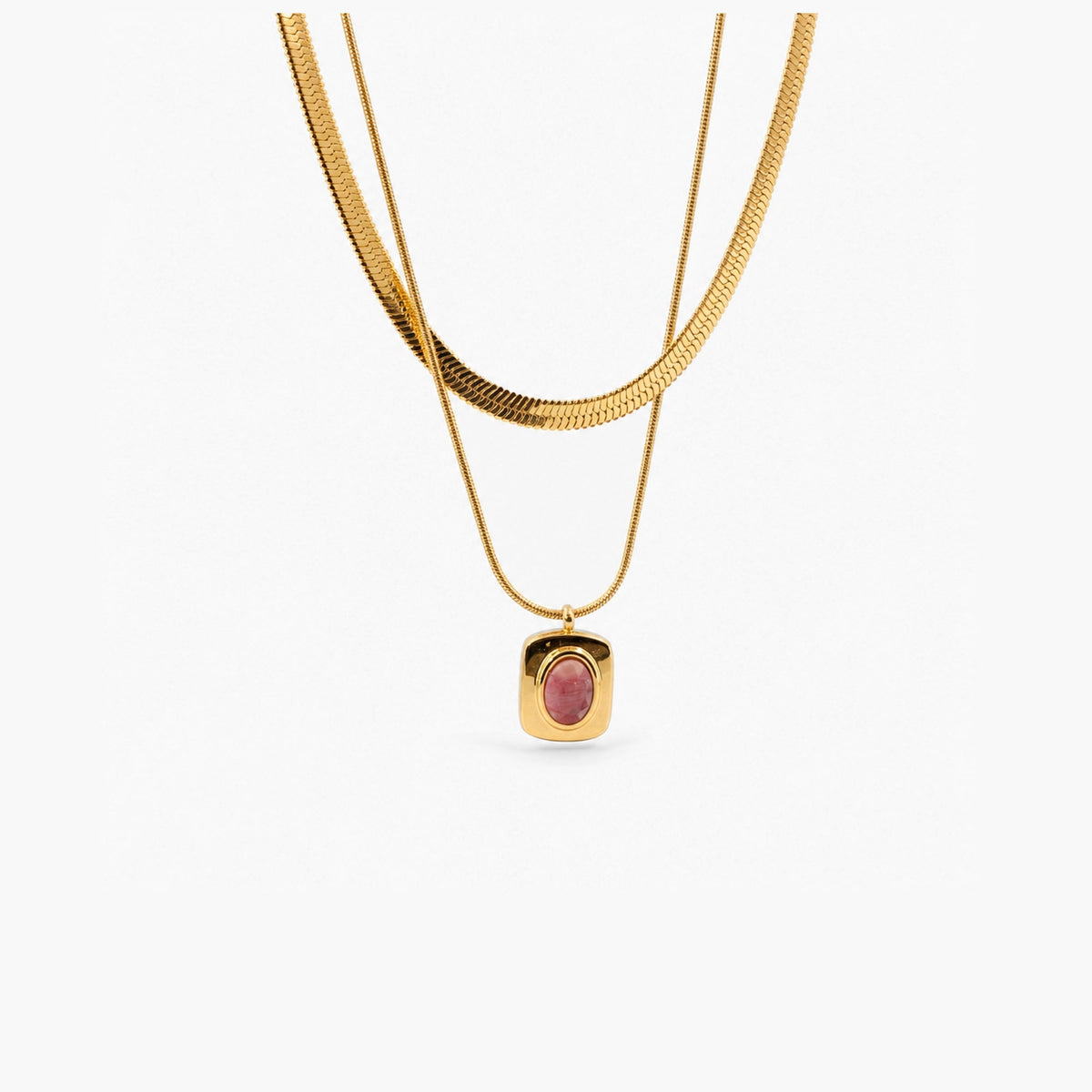 Layered necklace with a pink gemstone pendant