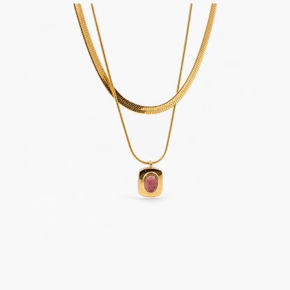 Layered necklace with a pink gemstone pendant