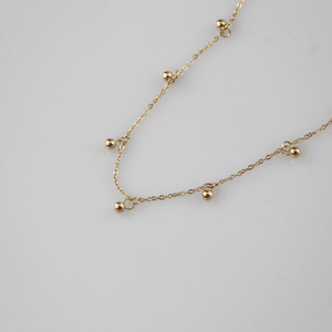 Gold Bead Station Necklace