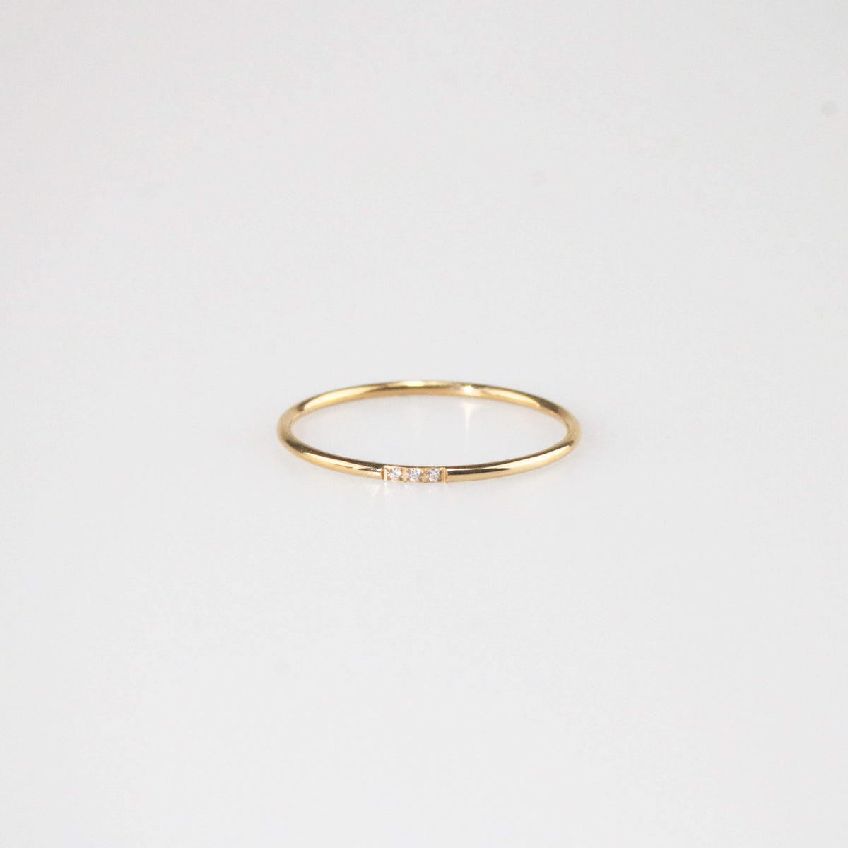 Minimal gold triple gem stacker ring