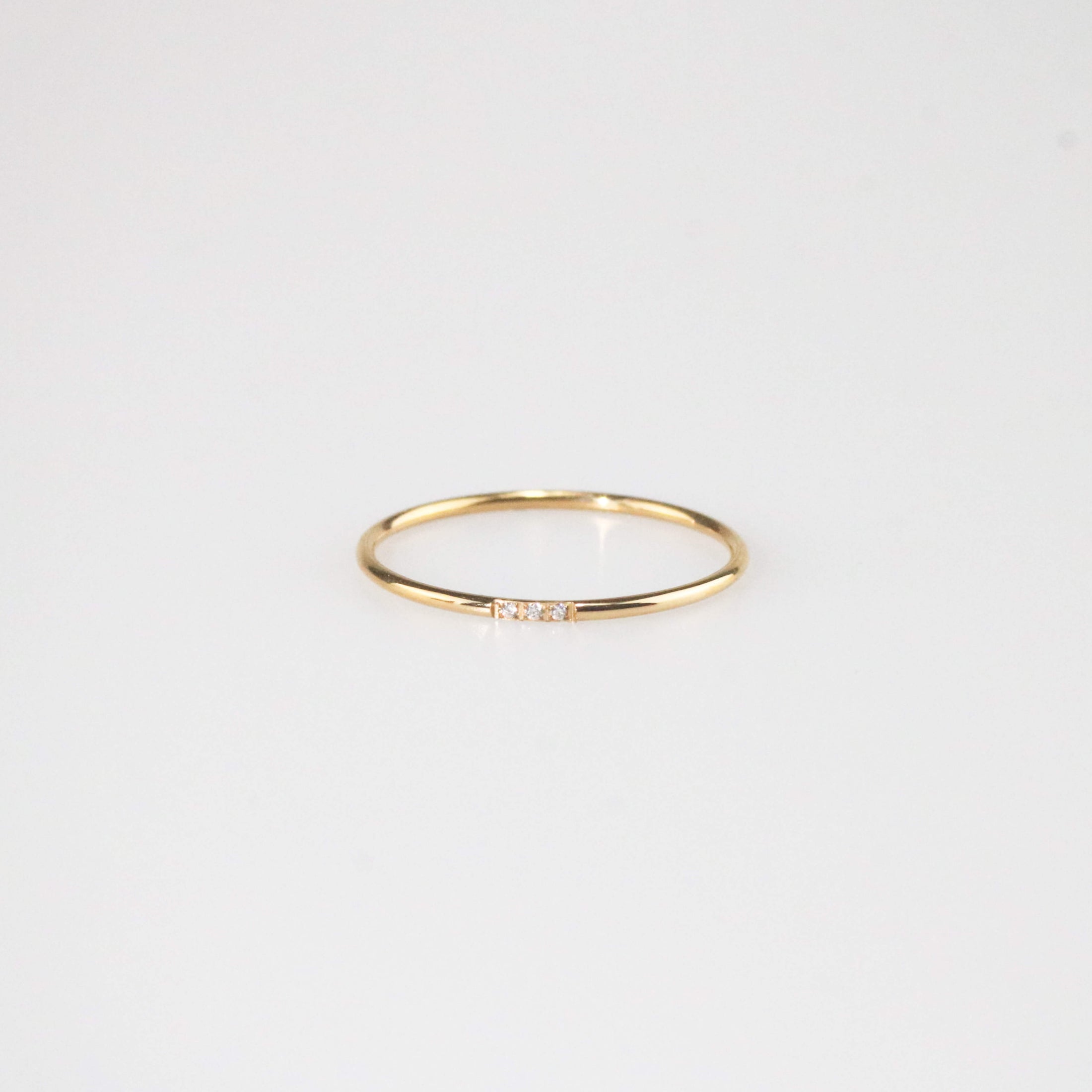 Minimal gold triple gem stacker ring