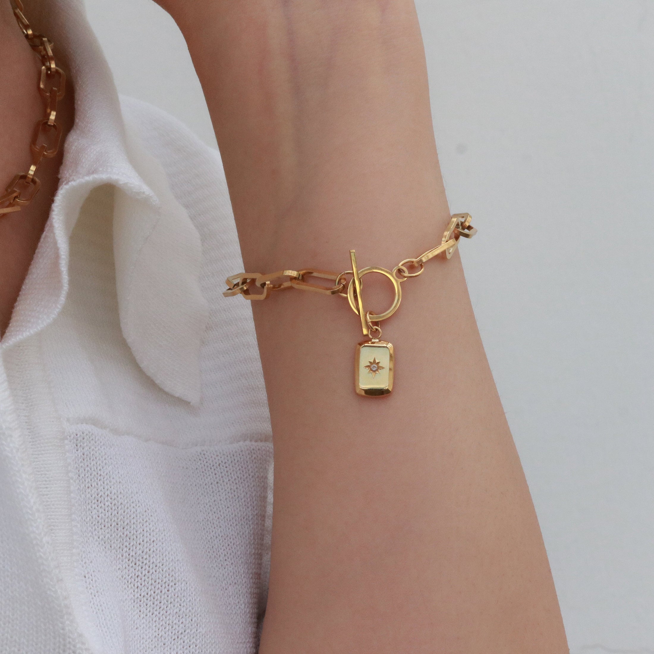 Starburst pendant link chain toggle bracelet