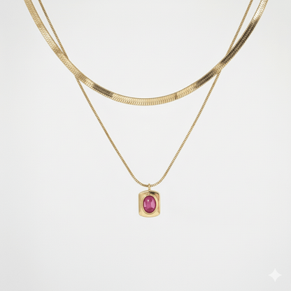 Layered snake chain necklace with a pink gemstone pendant