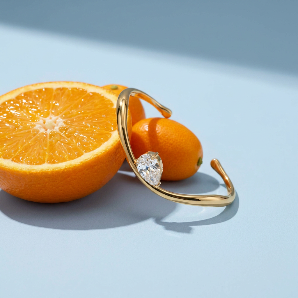Wavy Pear Cuff styled with fresh citrus in summer light
