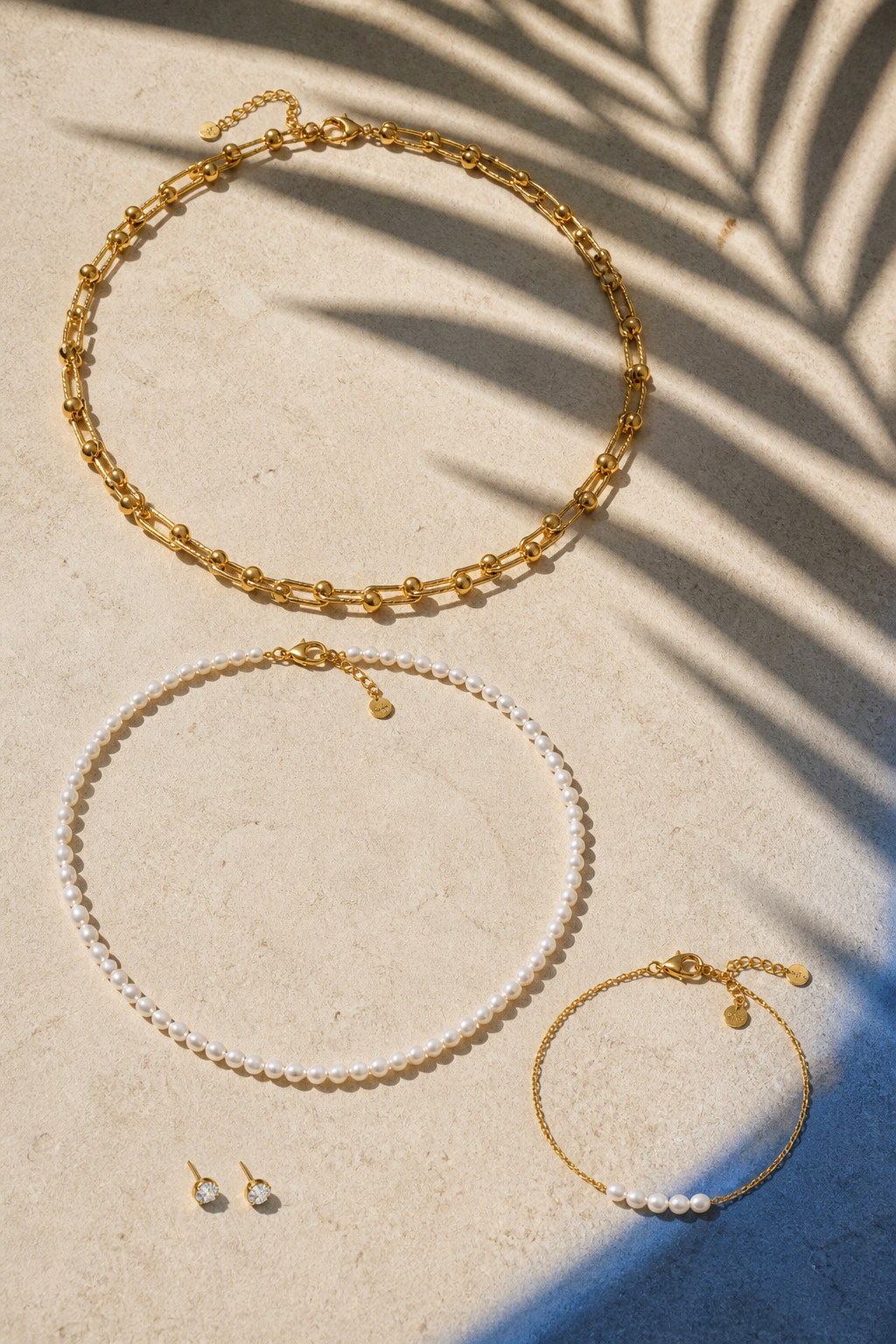 Palm Light Layers jewelry set — flat lay