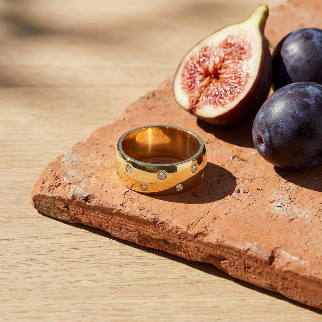 Stellar Band on a weathered terracotta tile with a cut fig and dark plums