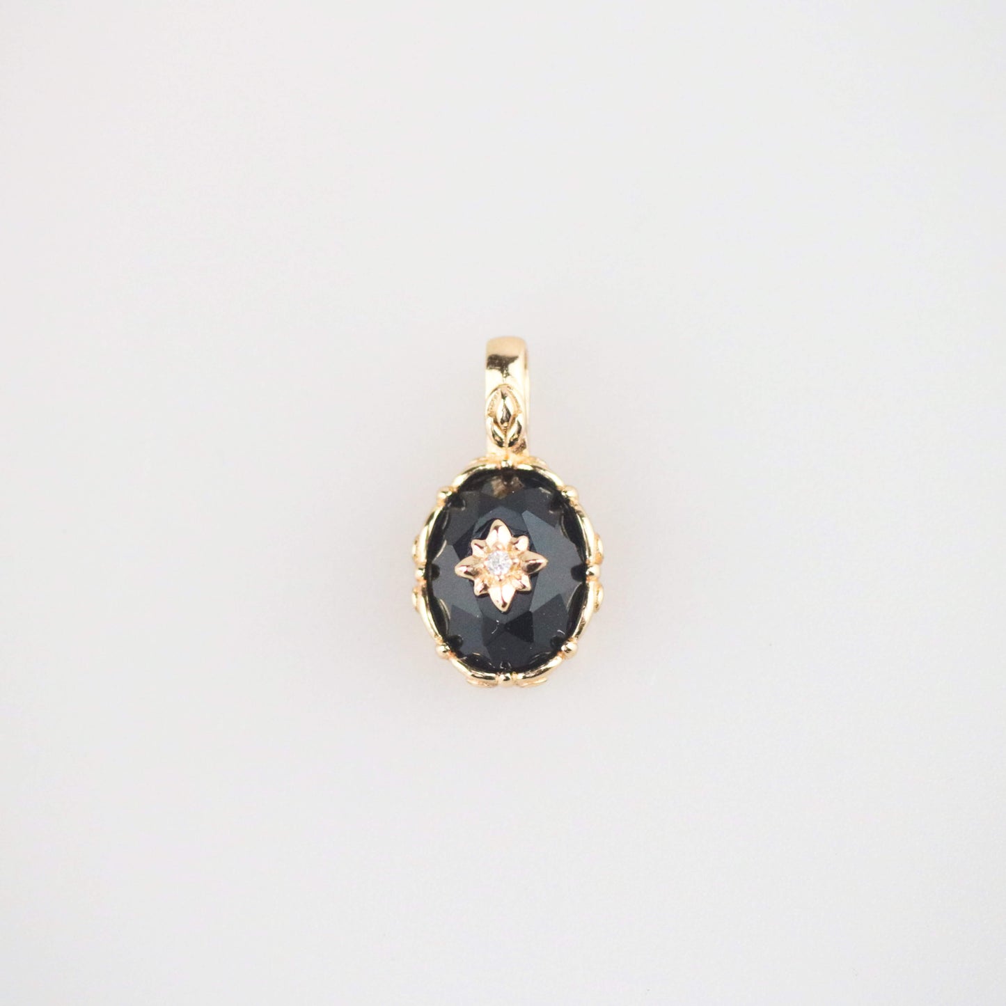 Black onyx starburst charm