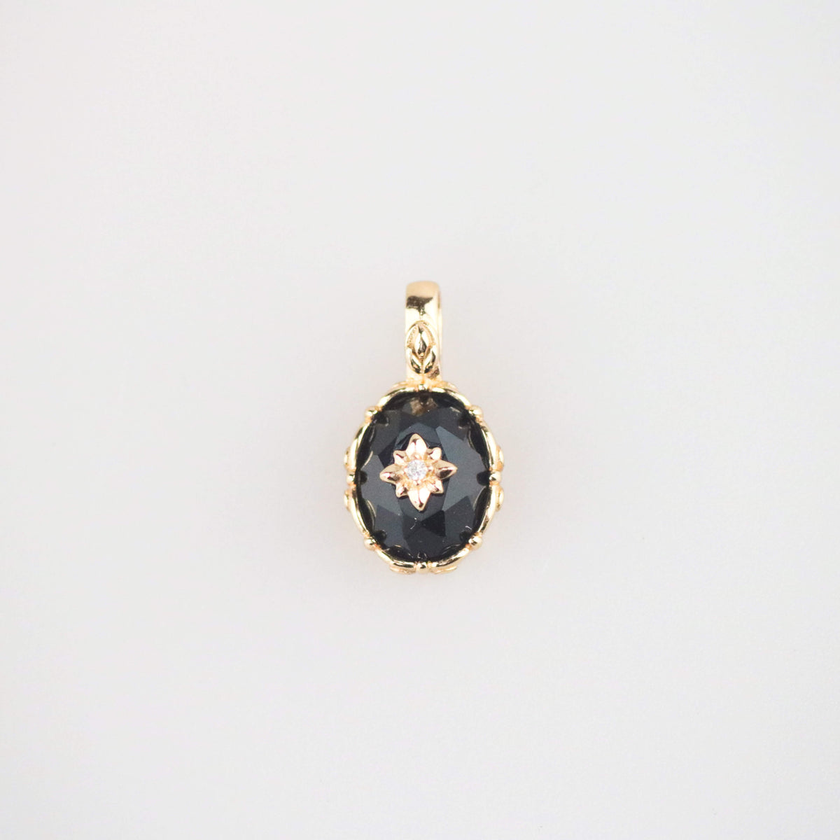 Black onyx starburst charm